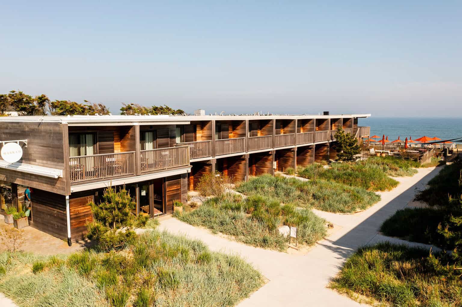 Aerial view of Marram Montauk resort nestled among sand dunes on the Atlantic