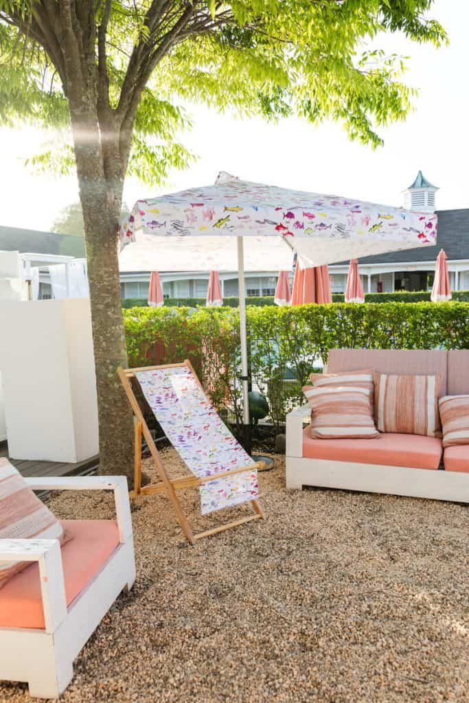 Maison Close Southampton patio with pink umbrellas at The Capri