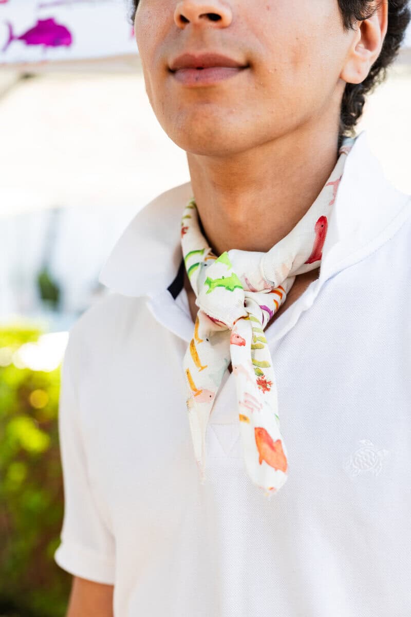 Server in a Vilebrequin Pescador neckerchief and bucket hat at Maison Close Southampton