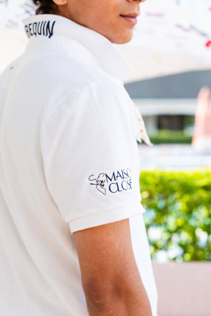 Maison Close Southampton server uniform with Vilebrequin neckerchief and Maison Close sleeve branding