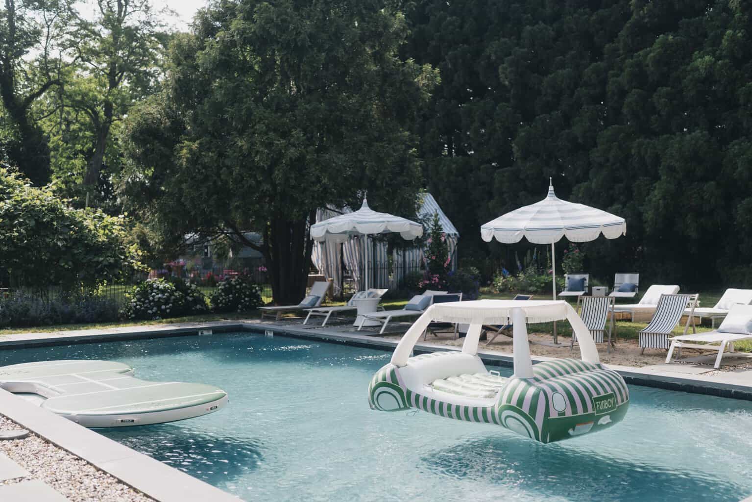 The pool and gardens at A Room at the Beach in Bridgehampton