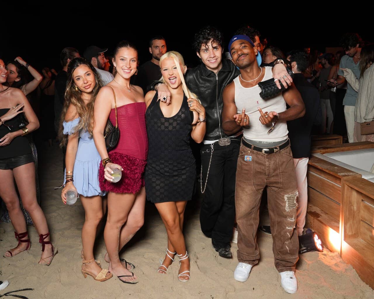 Guests around the bonfire at Elie Tahari's Fourth of July celebration in the Hamptons