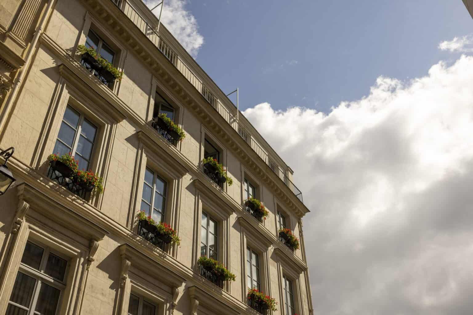 The 19th-century facade of J.K. Place Paris on Rue de Lille