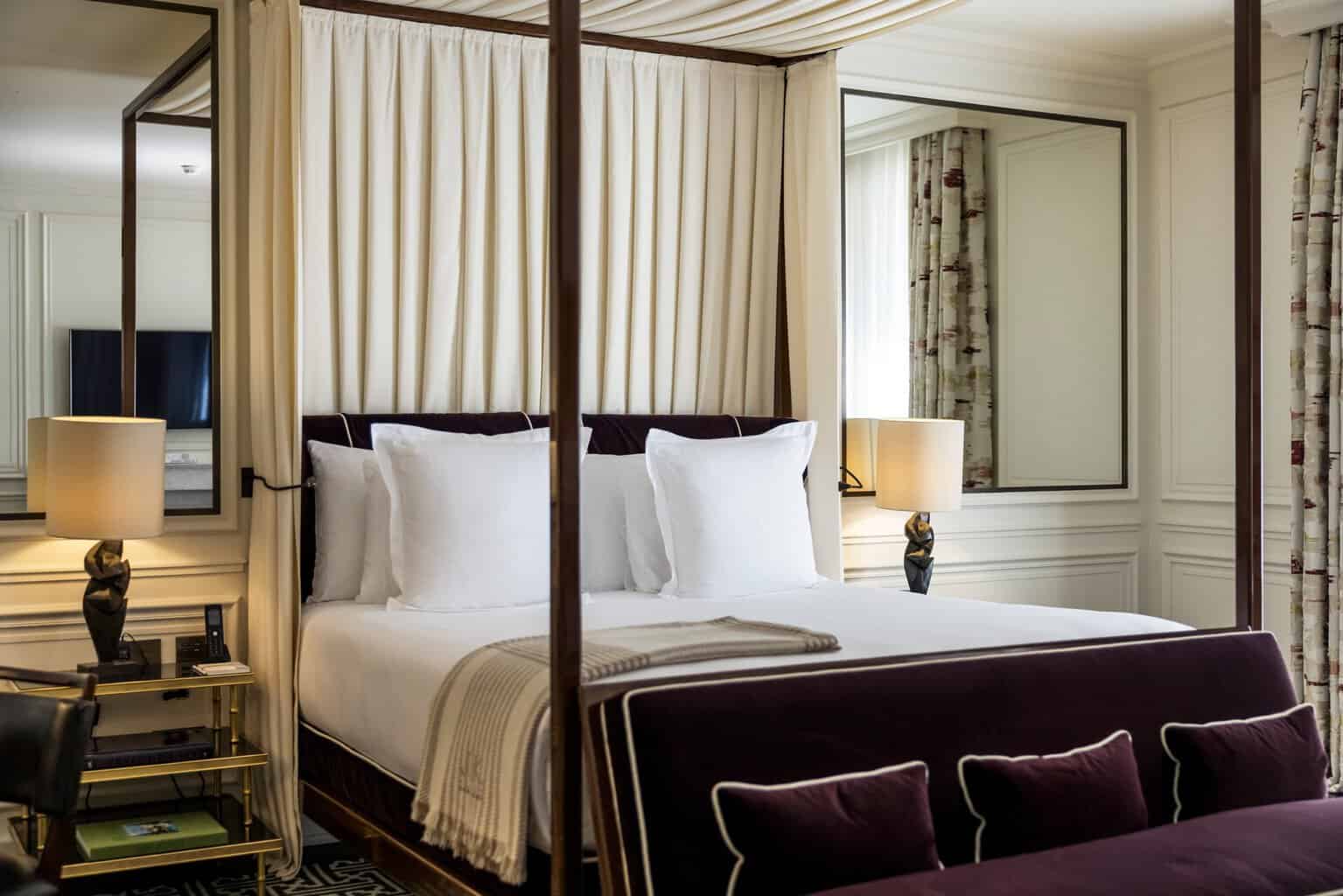 A four-poster guest room at J.K. Place Paris