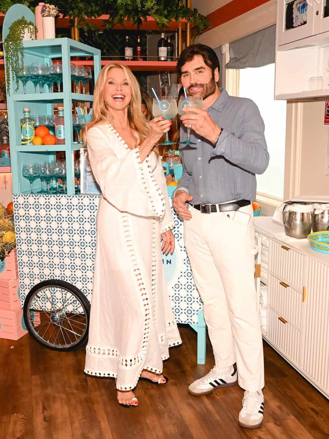 Christie Brinkley raising a Malfy Gin spritz at the Project Zero cocktail cart
