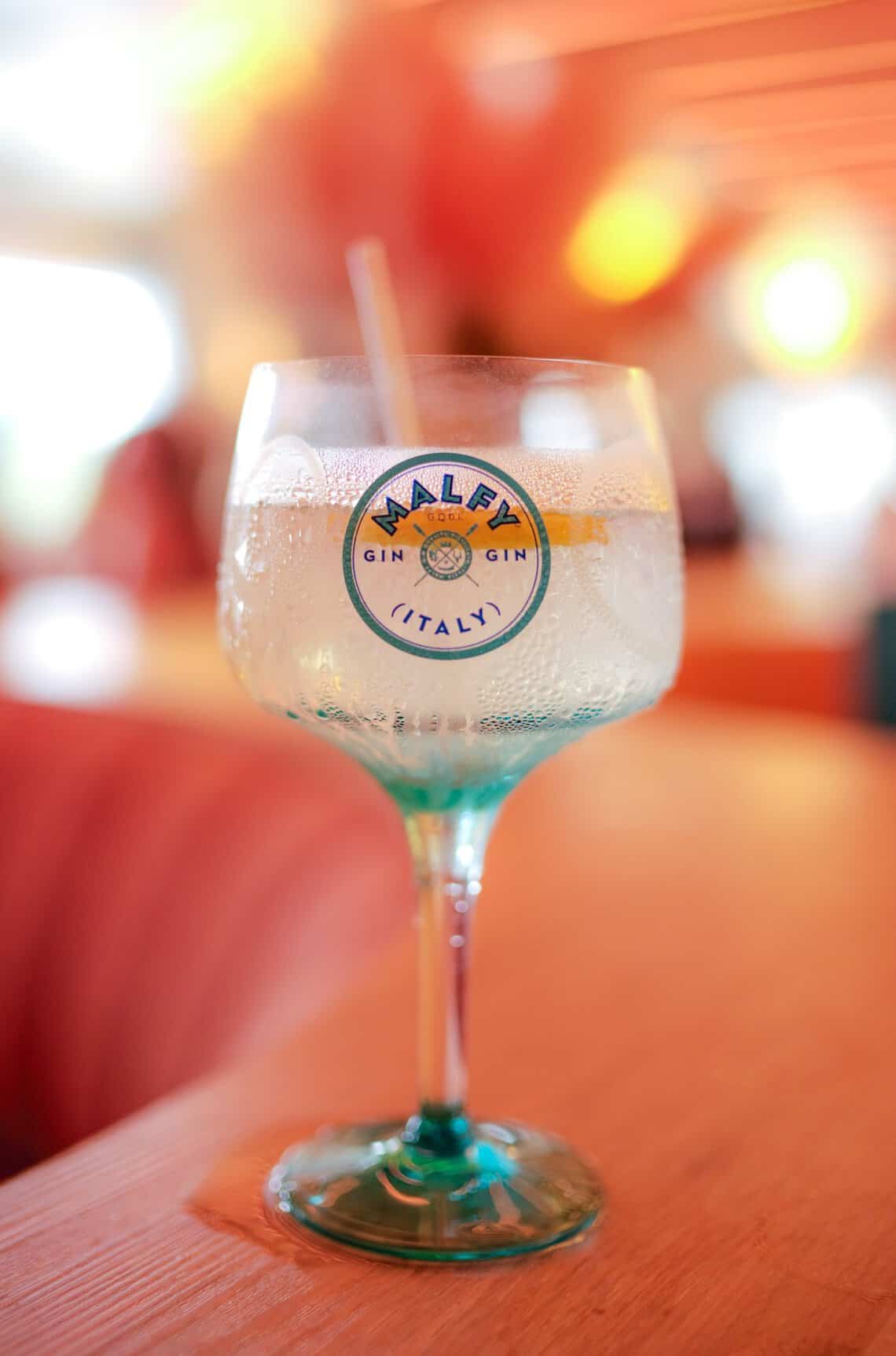 A Malfy Gin summer spritz served in custom blue glassware at the Project Zero benefit