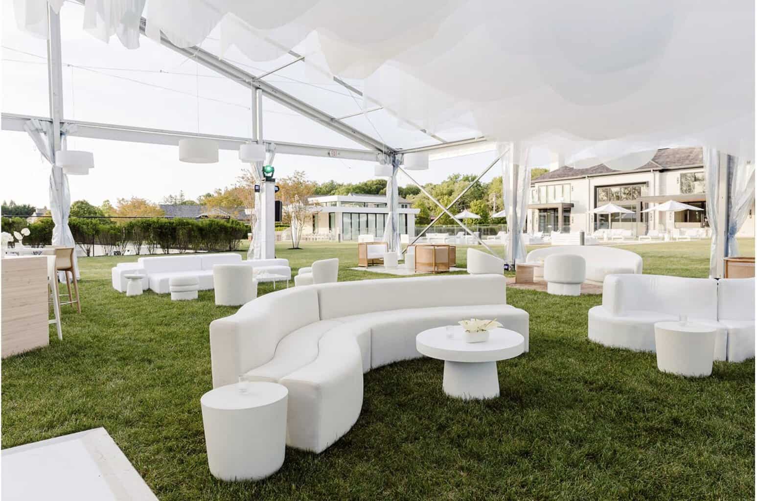 White curved lounge seating by Decco on the lawn at a Hamptons event