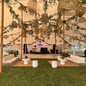 A Decco by Party Up Productions lounge and tent setup at a Hamptons event