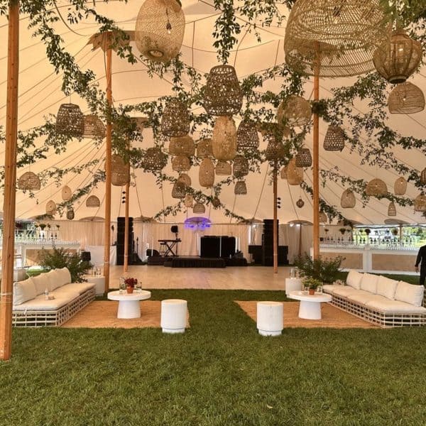 A Decco by Party Up Productions lounge and tent setup at a Hamptons event
