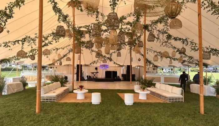 A Decco by Party Up Productions lounge and tent setup at a Hamptons event