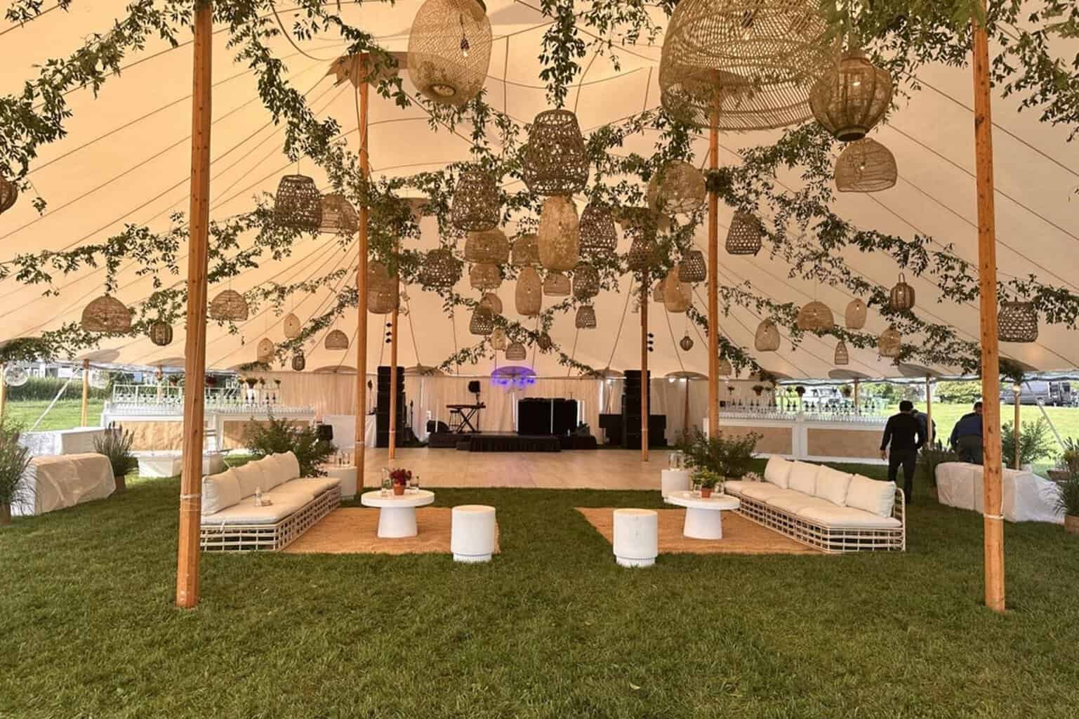 A Decco by Party Up Productions lounge and tent setup at a Hamptons event