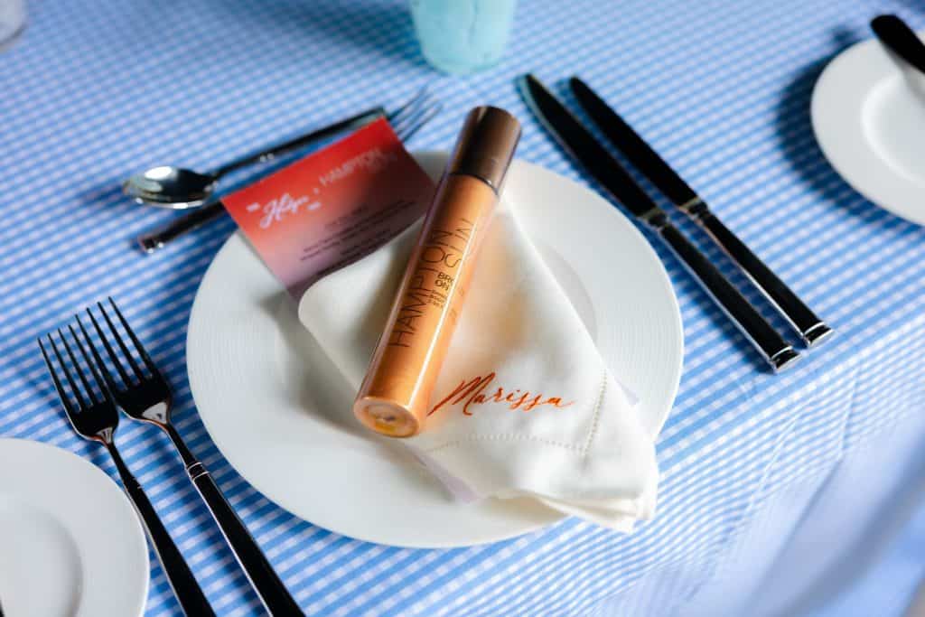 A Hampton Sun bottle at a place setting at the East Hampton luncheon