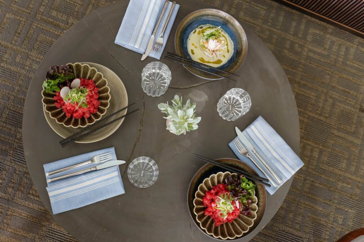 Plated dishes from The Loren at Pink Beach’s culinary program