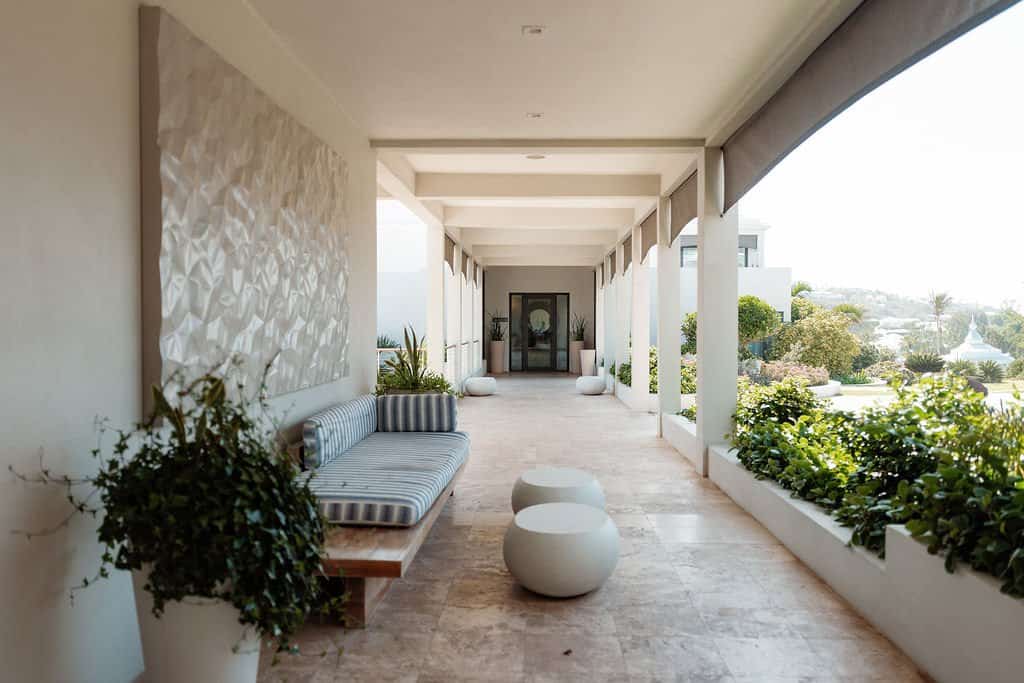 An open-air terrace at The Loren at Pink Beach connecting indoors and out