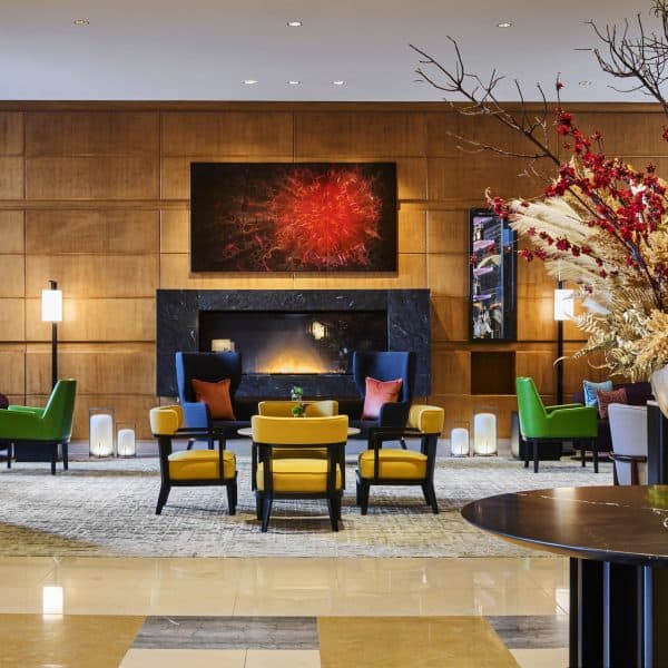 Lobby seating area with fireplace and contemporary art at Mandarin Oriental, Boston